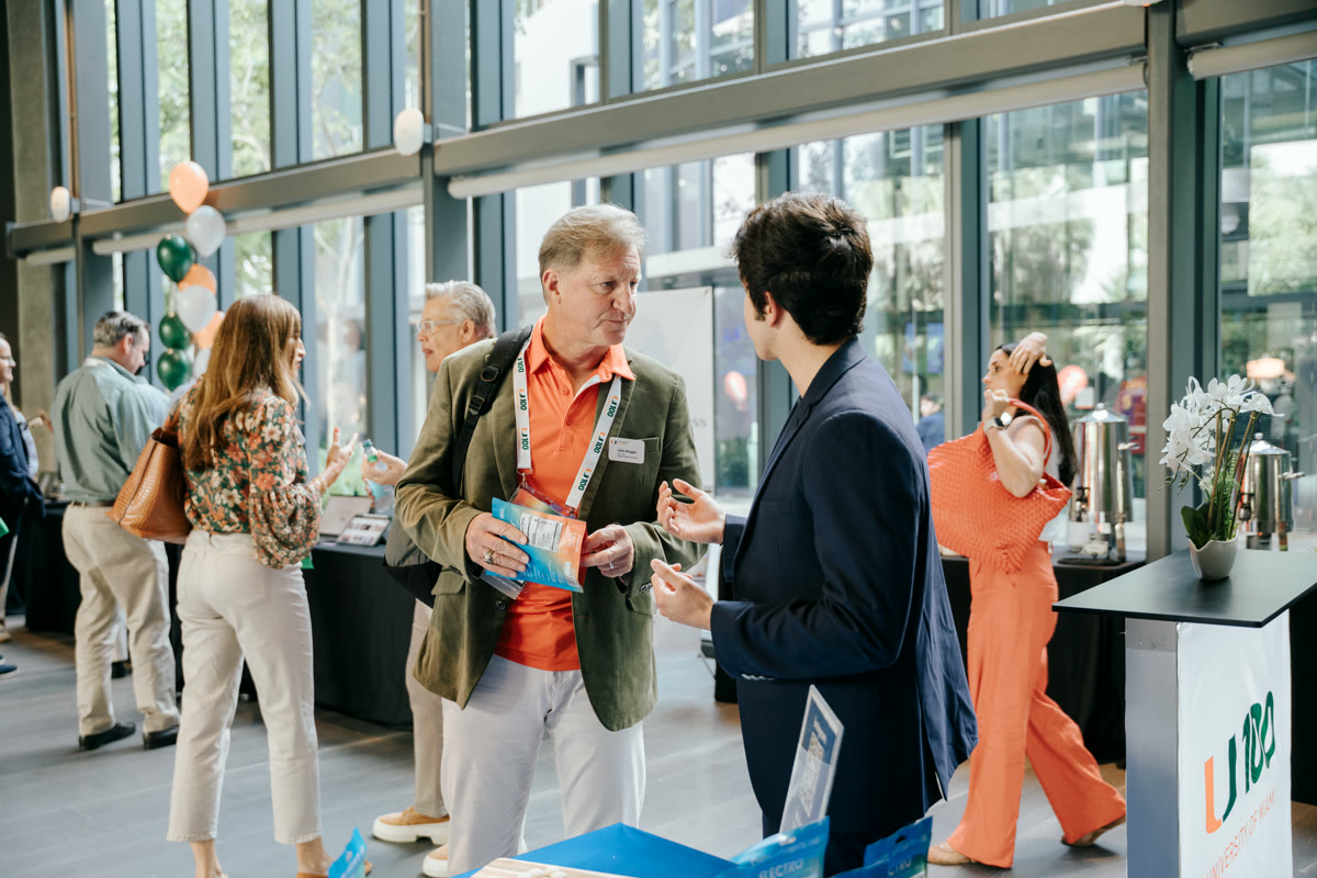 Electro intern meeting an alumnus at a University of Miami networking event