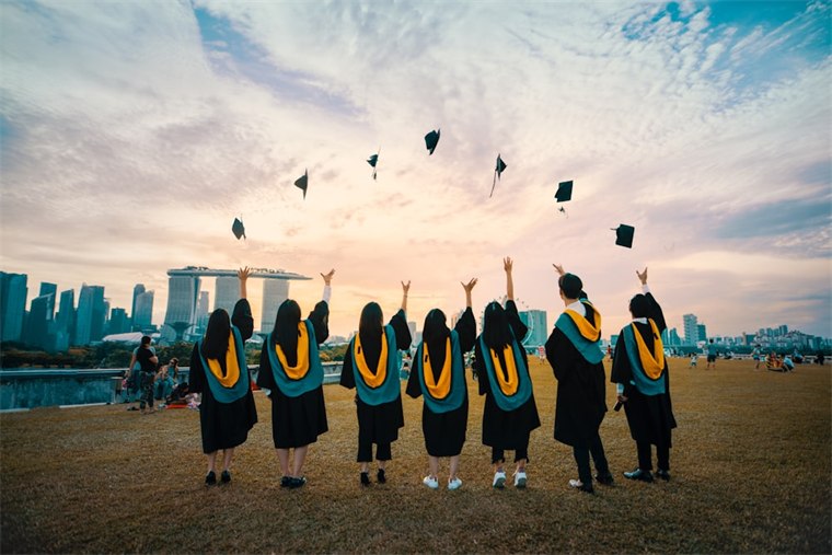 Graduation caps in the air