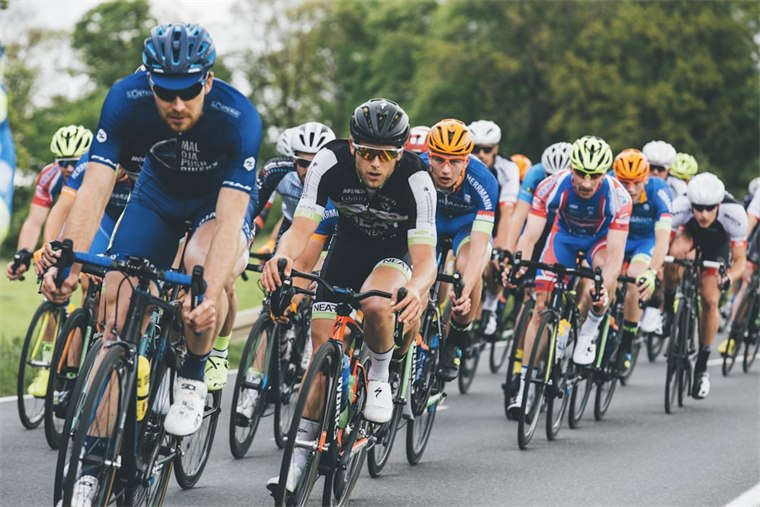 Cyclists mid race